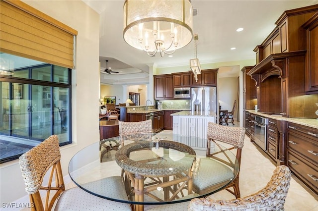 dining room featuring ceiling fan with notable chandelier, ornamental molding, baseboards, and recessed lighting