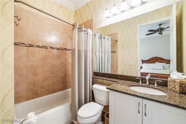 bathroom with toilet, ornamental molding, shower / tub combo, vanity, and wallpapered walls