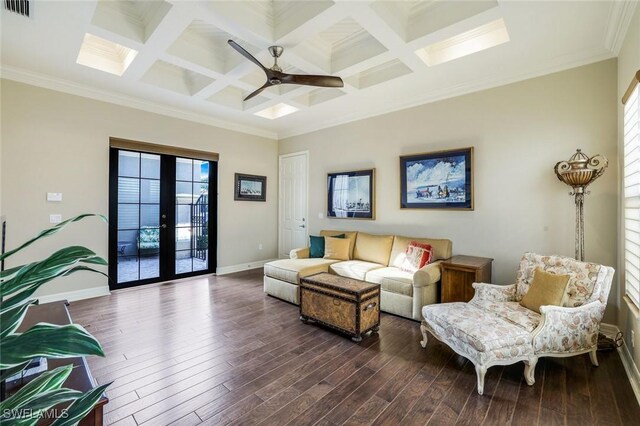 living room with coffered ceiling, visible vents, dark wood finished floors, and french doors