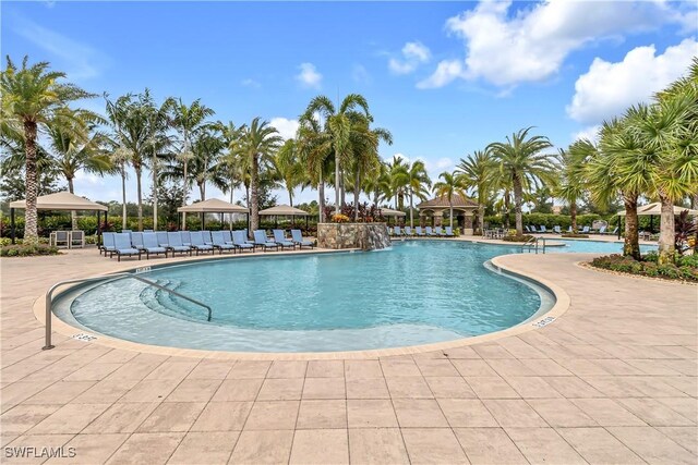 community pool with a patio and a gazebo