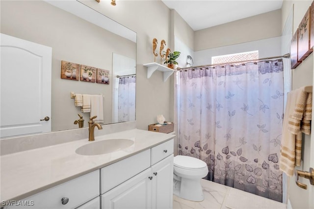 bathroom with a shower with curtain, toilet, marble finish floor, and vanity