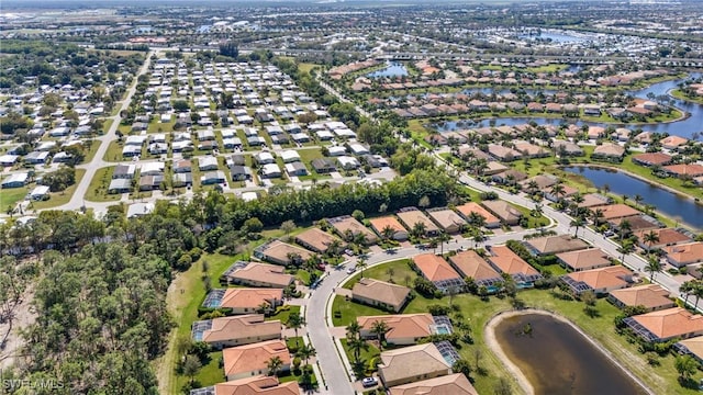 aerial view featuring a residential view and a water view