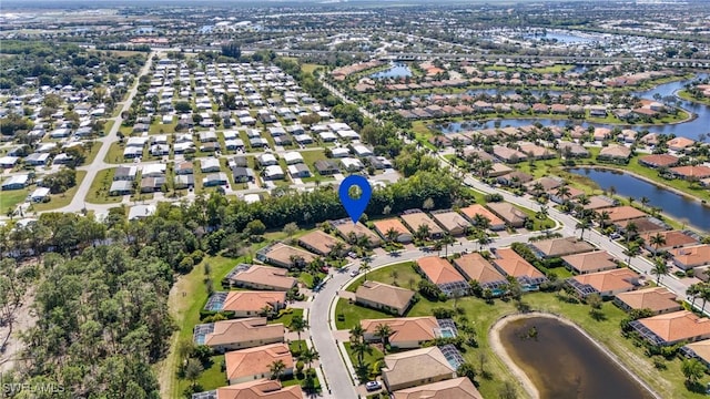 aerial view featuring a residential view and a water view