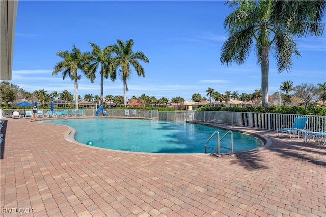 pool featuring a patio and fence