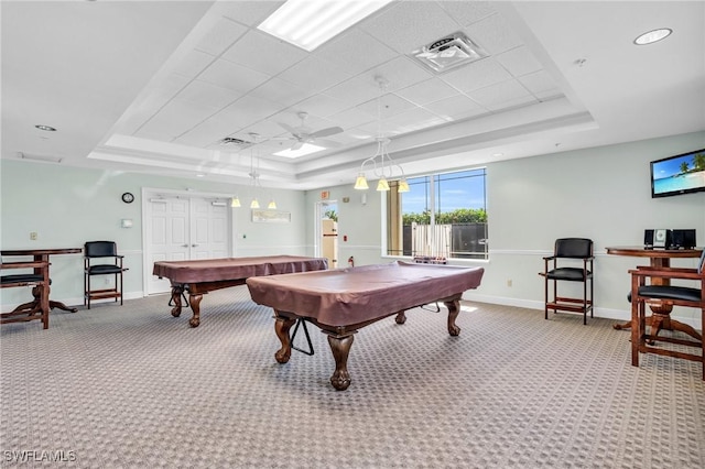 rec room with a tray ceiling, carpet, visible vents, and pool table