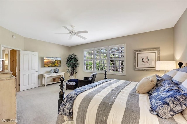 carpeted bedroom with a ceiling fan