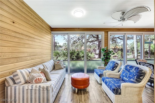 sunroom with a ceiling fan