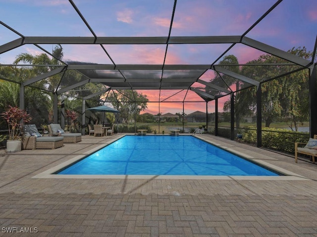 pool with a patio and a lanai