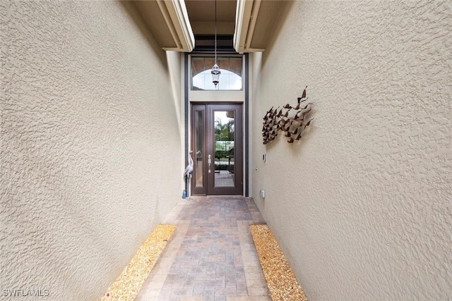 property entrance featuring stucco siding