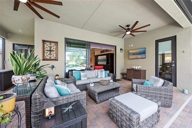 view of patio with a ceiling fan and outdoor lounge area