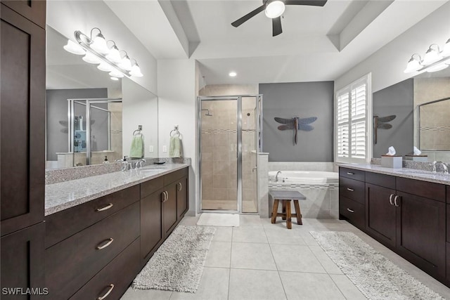 full bathroom with two vanities, a sink, a shower stall, and tile patterned floors