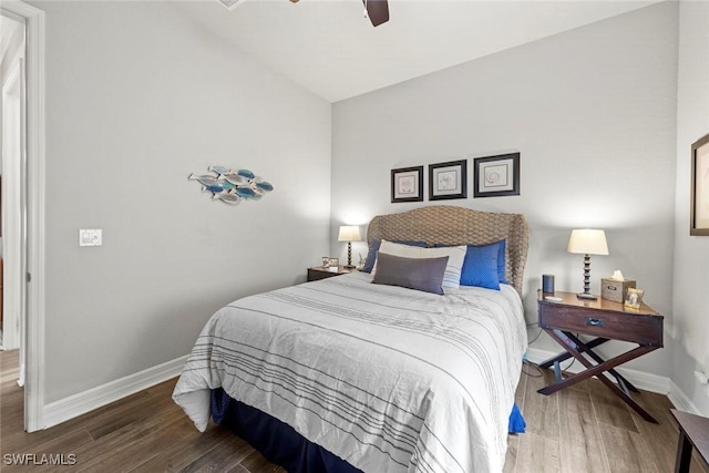 bedroom featuring vaulted ceiling, ceiling fan, baseboards, and wood finished floors