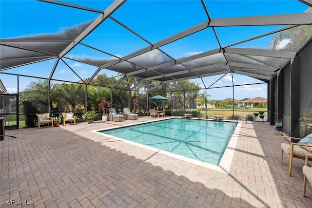 pool featuring a lanai and a patio