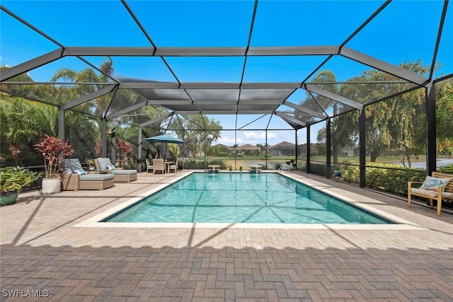 pool with a lanai and a patio