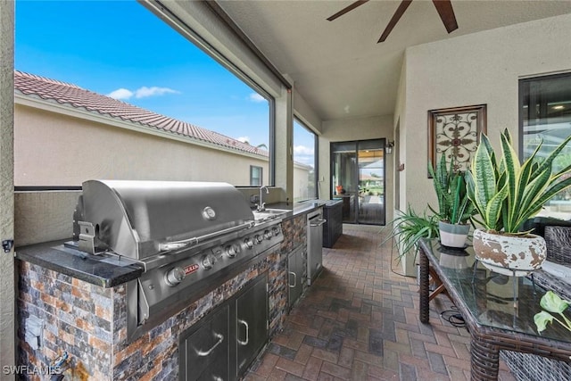 view of patio featuring ceiling fan and area for grilling