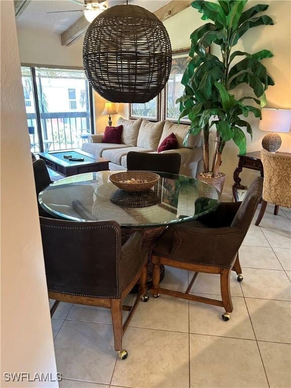 dining space featuring tile patterned floors and ceiling fan