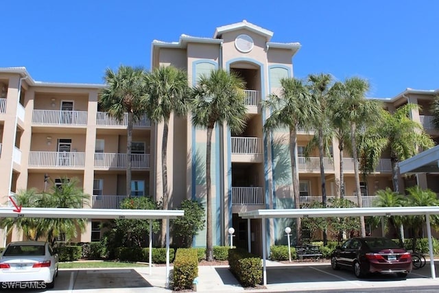 view of property featuring covered parking