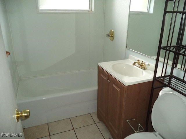 bathroom with vanity, tile patterned flooring, and toilet