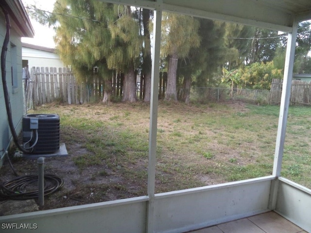 view of yard with a fenced backyard and cooling unit