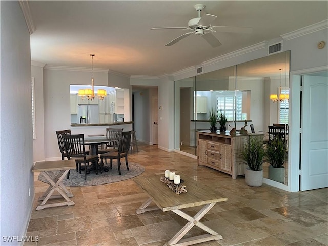 living room with baseboards, crown molding, visible vents, and stone tile flooring