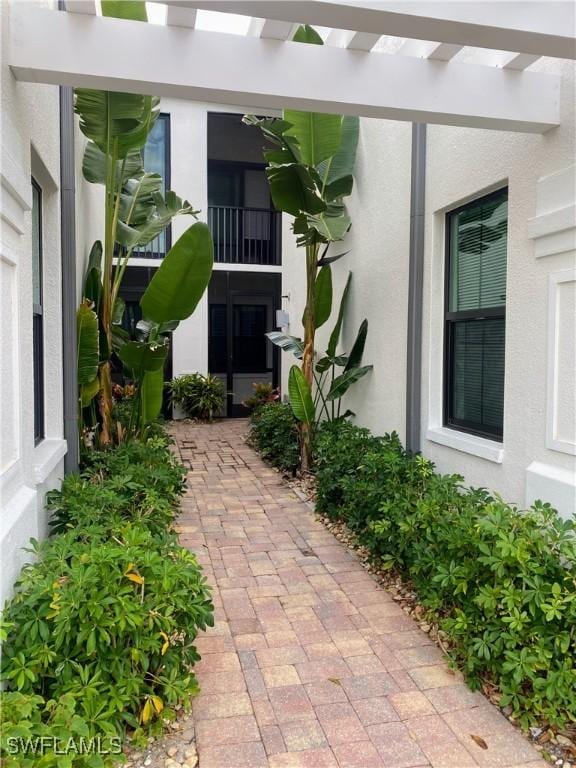 view of side of property with stucco siding