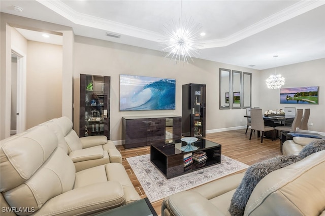 living room featuring visible vents, baseboards, an inviting chandelier, wood tiled floor, and a tray ceiling