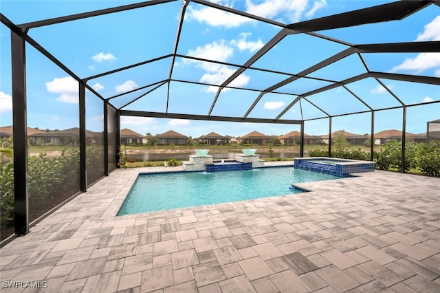 view of pool featuring a patio, a lanai, and a pool with connected hot tub