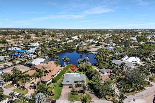 drone / aerial view featuring a residential view and a water view