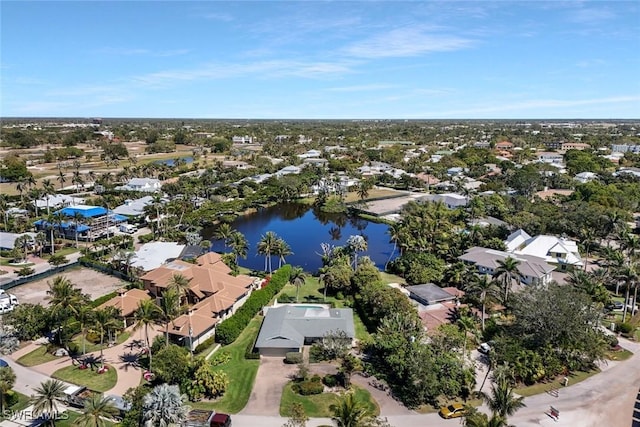 drone / aerial view featuring a water view and a residential view