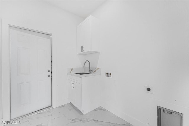 laundry room with hookup for a washing machine, electric dryer hookup, marble finish floor, and a sink