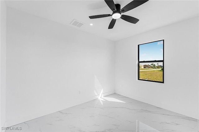 unfurnished room featuring recessed lighting, marble finish floor, visible vents, and baseboards