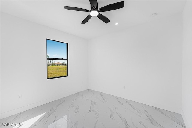 spare room with a ceiling fan, recessed lighting, and baseboards