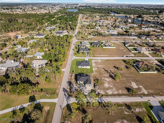 aerial view featuring a water view and a residential view