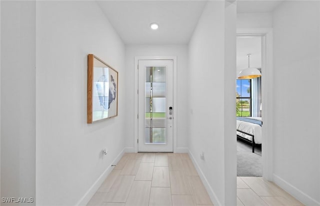 entryway featuring baseboards