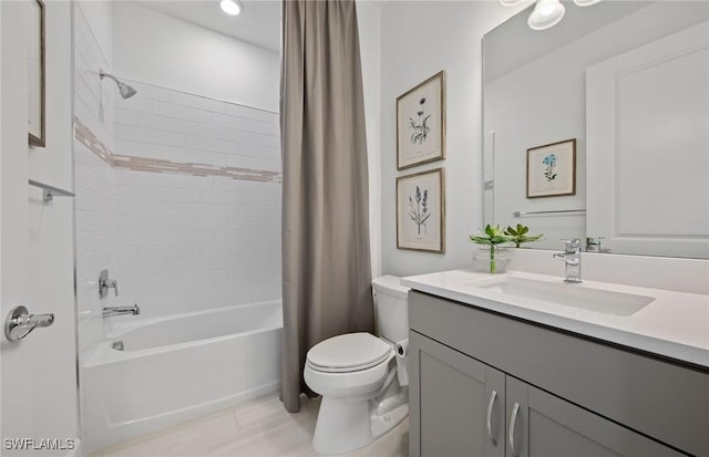 full bathroom featuring shower / bath combination with curtain, vanity, and toilet