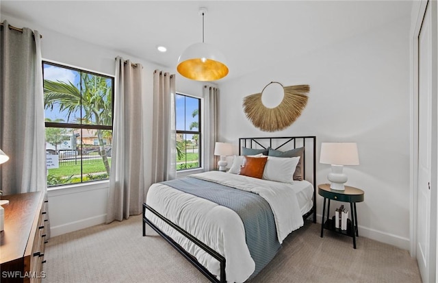 bedroom with light carpet, baseboards, and recessed lighting