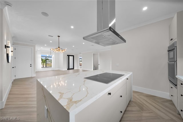 kitchen with island exhaust hood, black electric stovetop, open floor plan, and recessed lighting