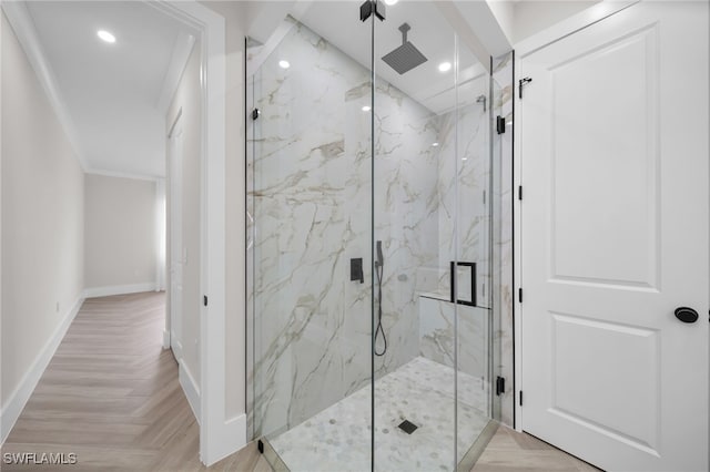 bathroom featuring a marble finish shower, baseboards, and recessed lighting