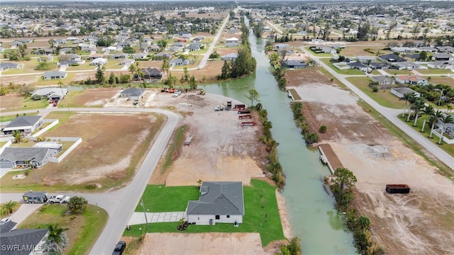 aerial view with a residential view and a water view