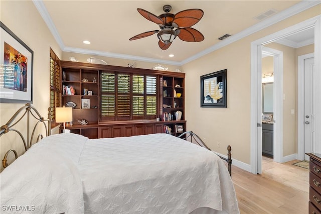 bedroom with visible vents, crown molding, and light wood finished floors