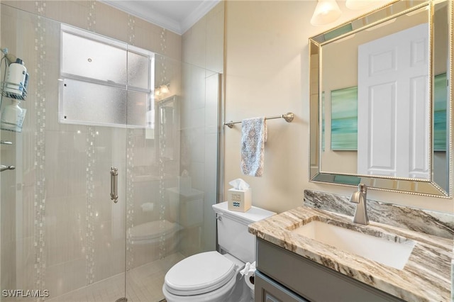 bathroom with a stall shower, crown molding, vanity, and toilet