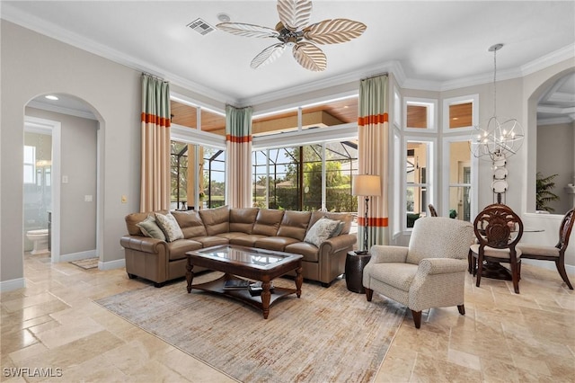 living room featuring a healthy amount of sunlight, visible vents, and arched walkways