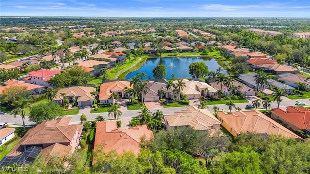 birds eye view of property with a residential view and a water view