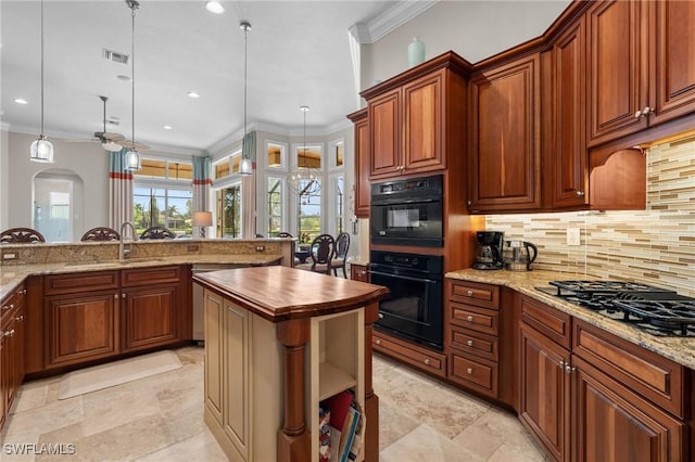 kitchen featuring visible vents, butcher block counters, crown molding, black appliances, and backsplash