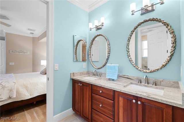 bathroom featuring ensuite bath, a sink, visible vents, and crown molding