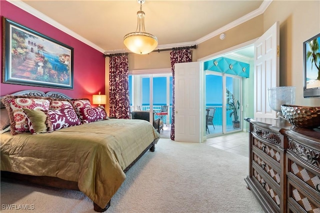 bedroom with ornamental molding, access to exterior, and carpet floors