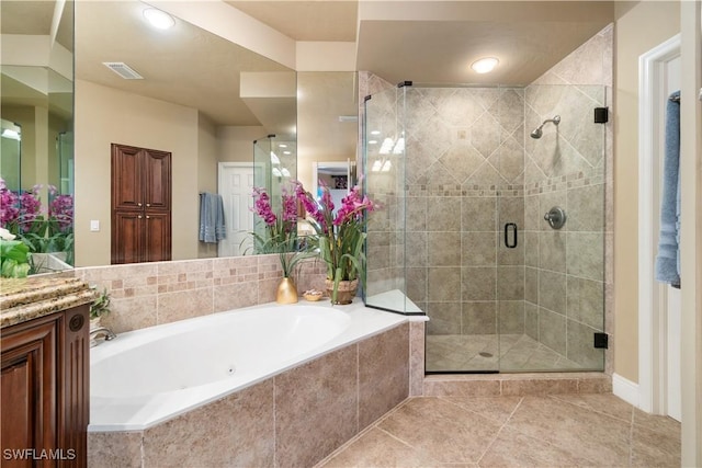 full bath featuring a bath, a shower stall, and visible vents