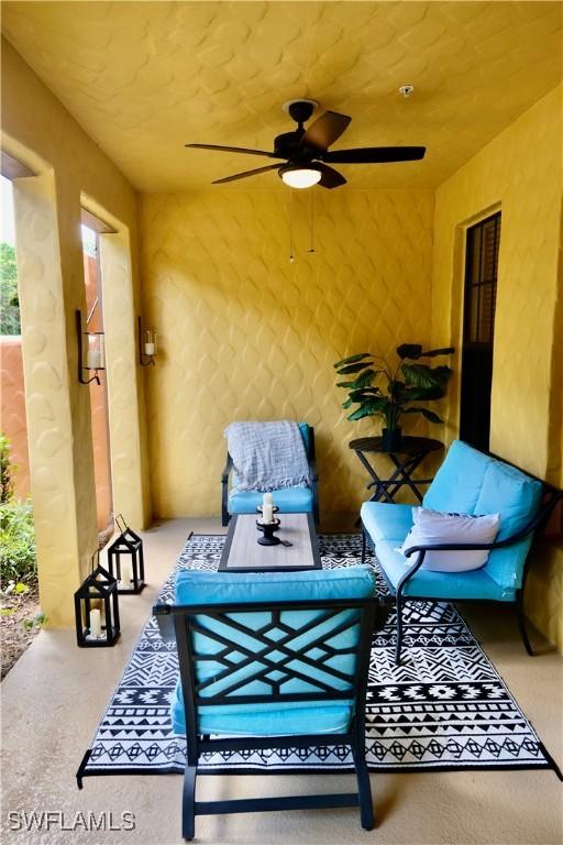 view of patio featuring an outdoor hangout area and a ceiling fan