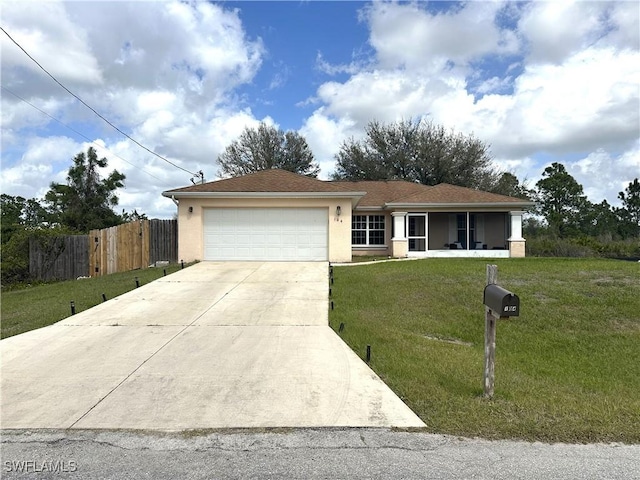 ranch-style house with a garage, fence, concrete driveway, stucco siding, and a front yard