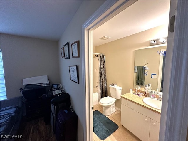 full bath featuring visible vents, toilet, tile patterned floors, shower / bath combo with shower curtain, and vanity